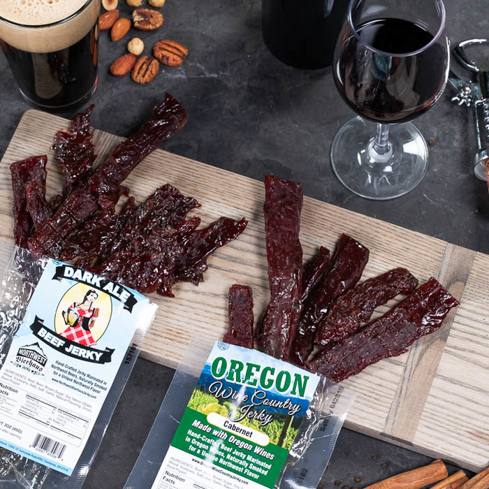 Booze infused jerkies on cutting board for men's gift.