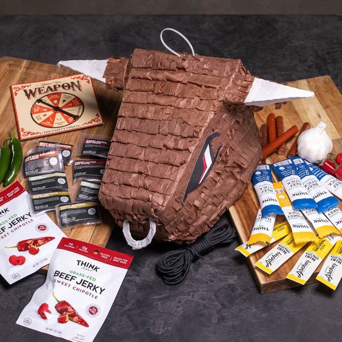 Bull's head Piñata with jerky bits and sticks surrounding it is a great men's interest gift.