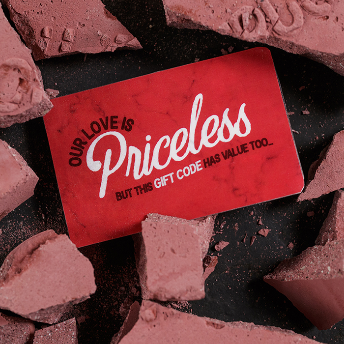 Gift card amid rubble saying "our love is priceless" for men's gift.
